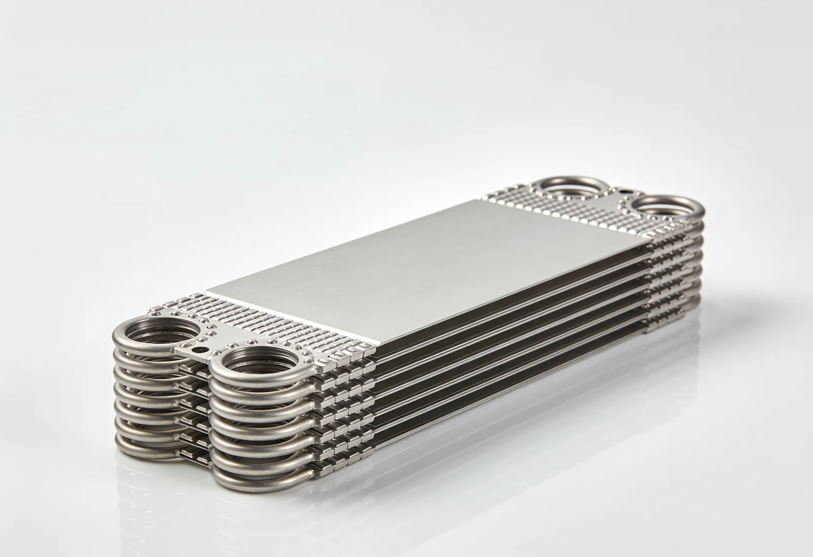 Titanium evaporator plate pack for a marine fresh water generator