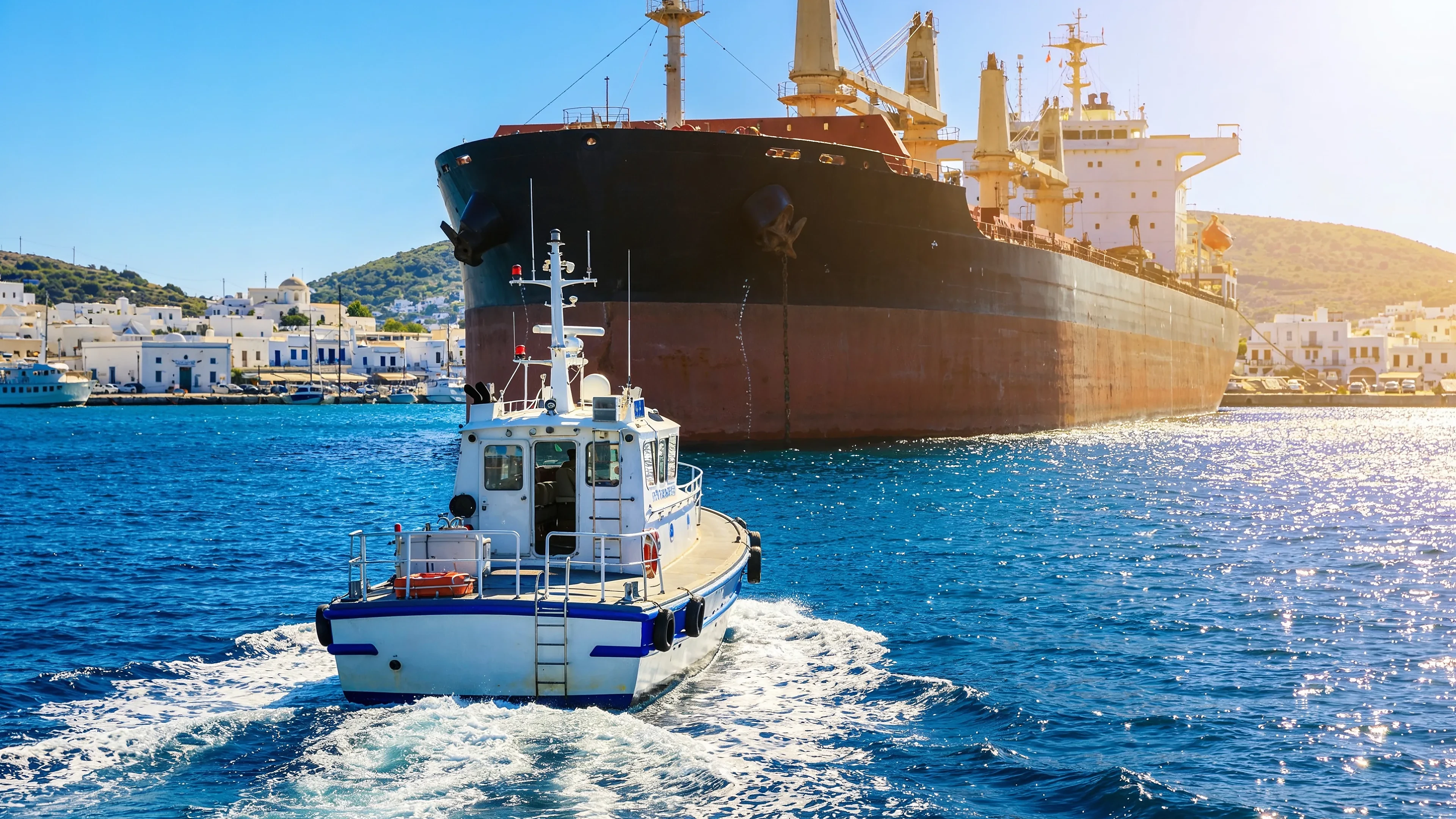 Ships and an agent launch in the harbour at Piraeus, Greece - last-mile spare-parts delivery